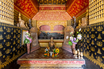 Interior of the Reclining Buddha Shrine (Red Chapel), Wat Xieng Thong, Luang Prabang, Laos, Indochina, Asia.