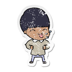 distressed sticker of a cartoon boy sticking out tongue