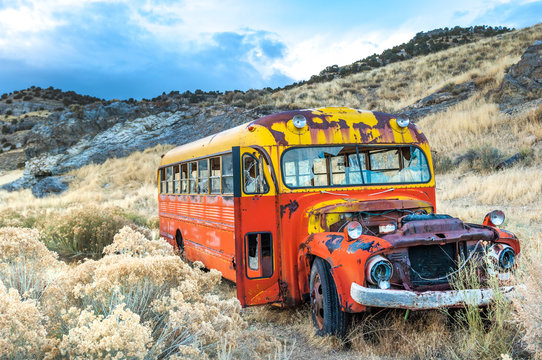 Rusty colorful old bus in Nevada ghost mining town, USA