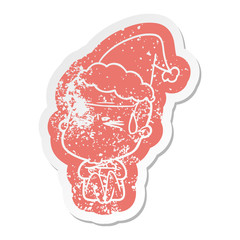 cartoon distressed sticker of a man sweating wearing santa hat