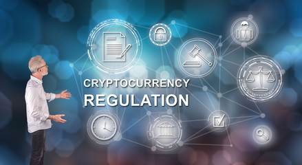 A cryptocurrency regulation concept explained by a businessman on a wall screen