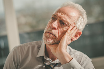 Thoughtful senior businessman