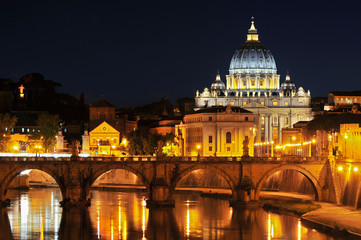 Fototapeta na wymiar Tiber with Sant'Angelo bridge and the St. Peter's Basilica in Rome, Italy.