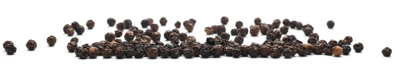 Black pepper grains isolated on white background