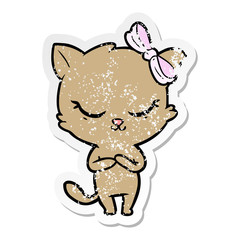 Obraz na płótnie Canvas distressed sticker of a cute cartoon cat with bow