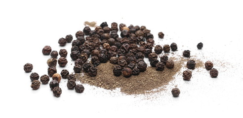 Black pepper grains and powder isolated on white background