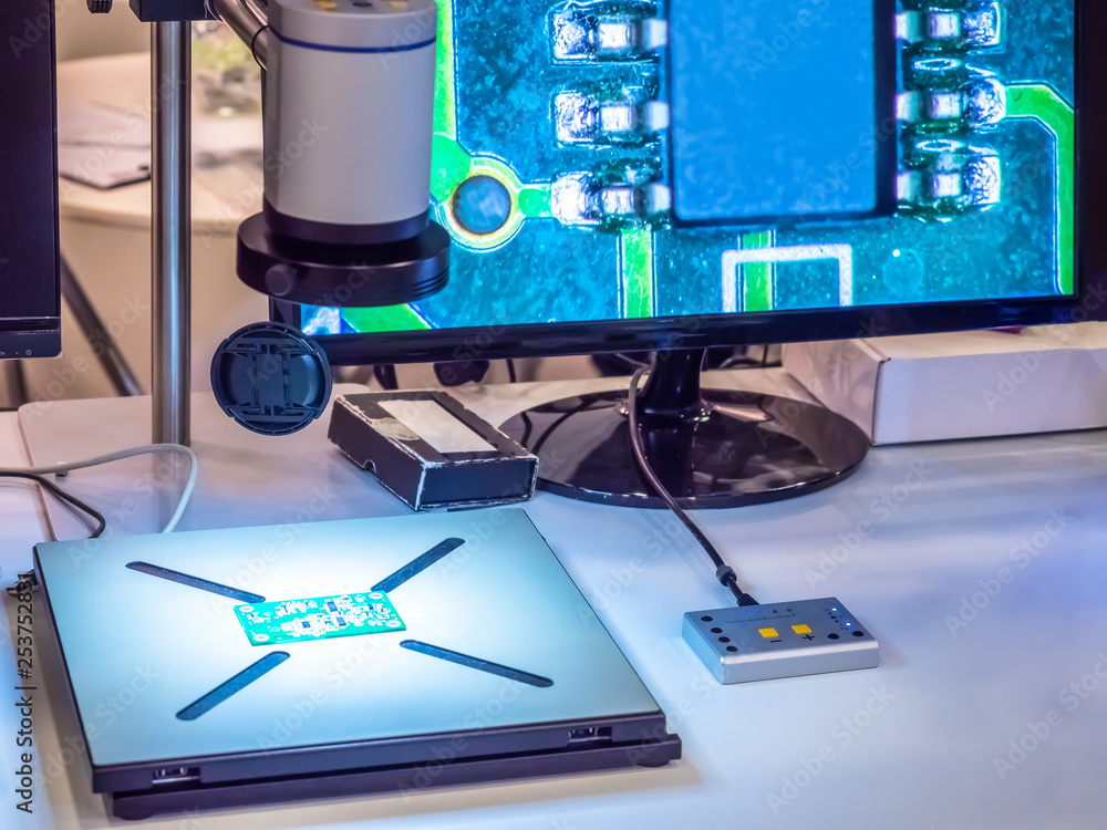 Poster chip manufacturing. microscope. check the quality of electronics. the microcircuit is studied under 