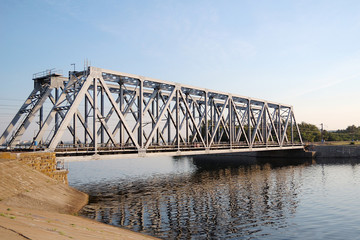 Railway bridge over the river in summer