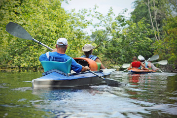 People canoe in a river