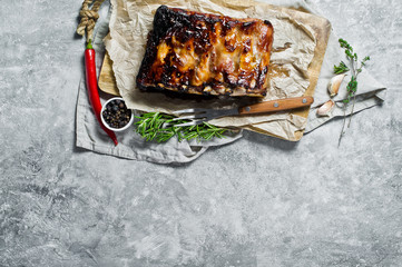 Grilled pork ribs. Gray background, top view, space for text