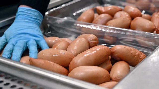 Sausages. Packing line of sausage.
