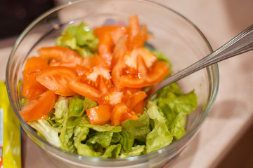 Cooking salad from fresh herbs.