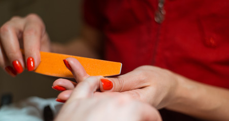 Male manicure. Manicurist makes care for male nails.