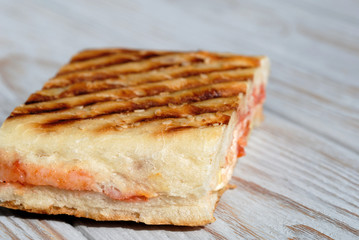 Slice toast with cheese and sausages closeup. Shallow depth of field