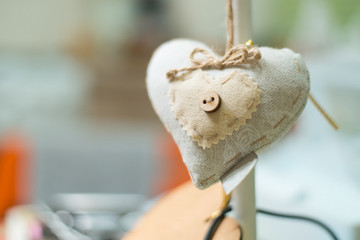 Rag soft heart with a button.