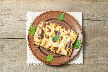 Cannelloni with minced beef and spinach baked in béchamel sauce. The view from the top. Copy-space.   