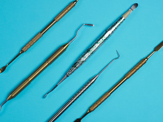 Professional dental tools on blue background