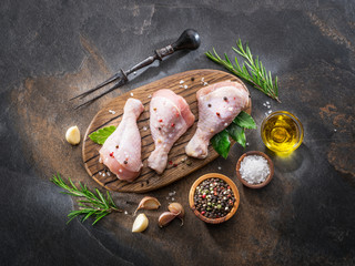 Chicken legs with spices and salt  ready for cooking.