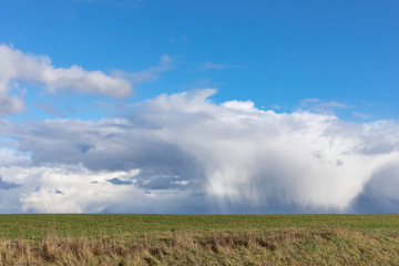 Green fields and blue skies over hessen in Germany