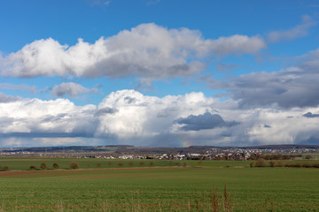 Obraz premium Green fields and blue skies over hessen in Germany