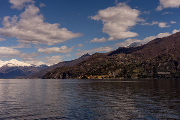 Obraz premium Italy, Bellagio, Lake Como, a large body of water with a mountain in the background