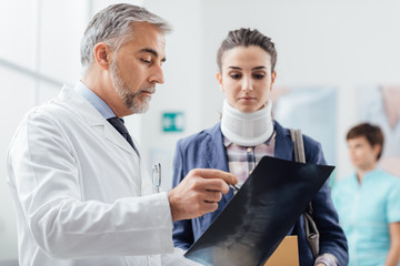 Doctor examining a patient's x-ray
