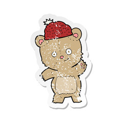 retro distressed sticker of a cartoon bear in hat