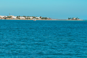 Obraz premium The boat goes on the open sea. aerial view of cruise tourist travel boat going on the sea