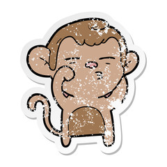 distressed sticker of a cartoon suspicious monkey