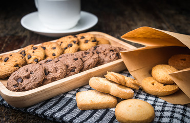 Chocolate chip cookies Closeup with cup on wooden tabel.