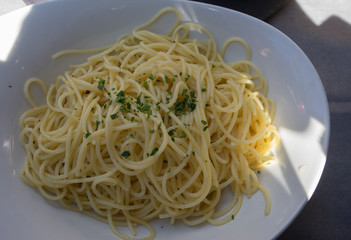 Italy, Bellagio, Lake Como, a bowl of pasta sits on a plate