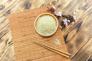 Raw rice in a bowl close-up