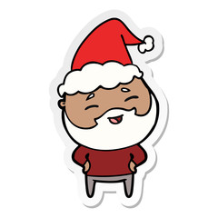 sticker cartoon of a happy bearded man wearing santa hat