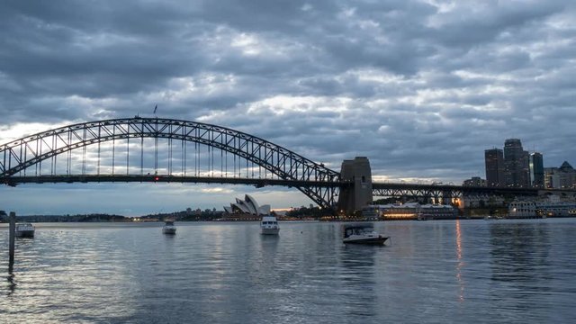 SYDNEY, AUSTRALIA - SEPTEMBER 16, 2016: 4K Cinematic Zooming Out Time Lapse Footage for Sydney city skyline at sunrise, taken from Blues Point Reserve north of Sydney.