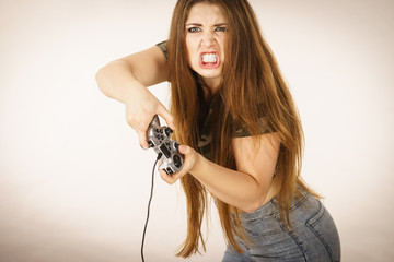 Angry woman holding gaming pad