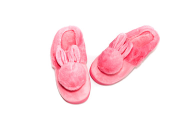 Pink female slippers on a white background