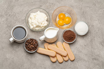 Ingredients for cooking tiramisu Savoiardi biscuit cookies, mascarpone, cream, sugar, cocoa, coffee and egg