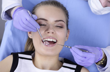 beautiful girl in the dental chair on the examination at the dentist