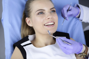 beautiful girl in the dental chair on the examination at the dentist