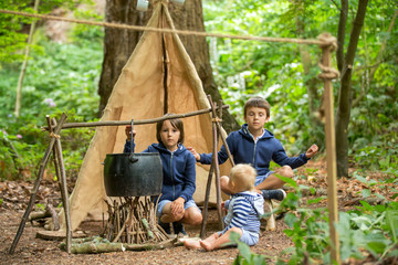 Beautiful children, siblings, camping in the forest © Tomsickova