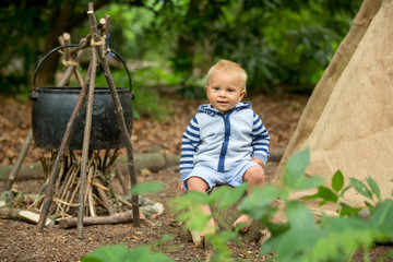 Beautiful children, siblings, camping in the forest