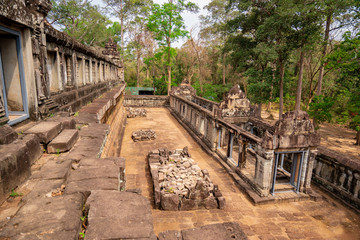 Fototapeta na wymiar Long hall and space between second and first enclosure walls of Ta Keo temple, Cambodia