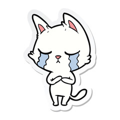 sticker of a crying cartoon cat