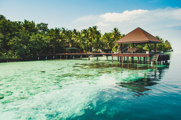 Pier for boat at a tiny amazing and romantic island in Maldives in Laccadive sea in Indian ocean...