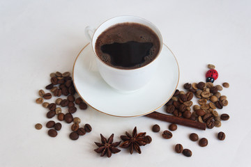 A cup of coffee with grains and anise stars. Candid.