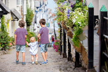 Beautiful family, walking on the streets of Clovelly, nice old village in the heart of Devonshire