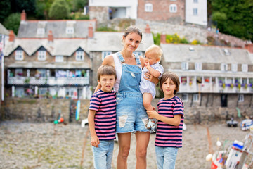 Beautiful family, walking on the streets of Clovelly, nice old village in the heart of Devonshire