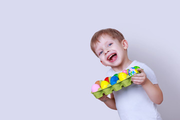 Boy with painted eggs