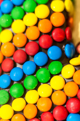Birthday cake covered colourful candies 