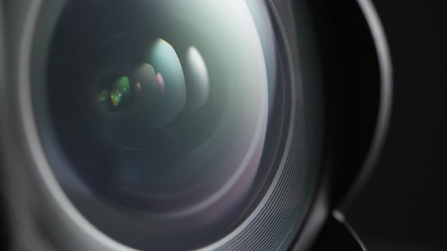 Macro close up shot of wide angle lens spinning towards camera